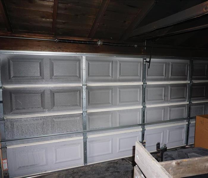 Soot covers garage door after fire